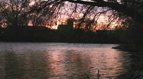 Sunset reflection over river with background church Stock Footage 414867
