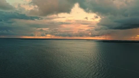 Sunset reflection over tranquil waters in a serene landscape Stock Footage 307642511