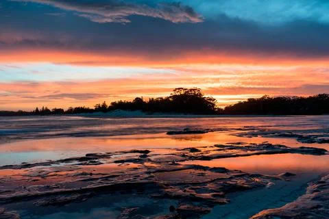 Sunset reflection pools on the gold coast of australia dramatic and colorful Stock Photos