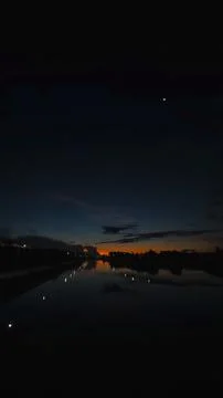 Sunset Reflection on River at Night 스톡 사진