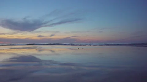 Sunset reflection on sandy beach Stock Footage 68526617