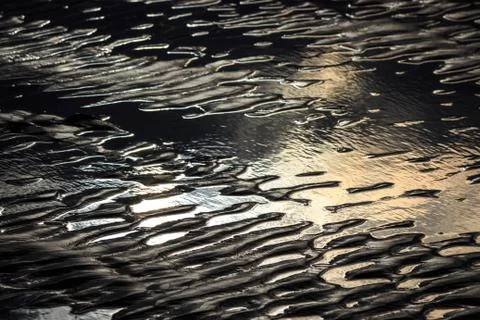 Sunset reflection Sandy Wet beach 库存照片