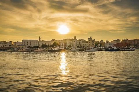 Sunset reflection shimmers and dances on the gentle ripples of the water ov.. Stock Photos
