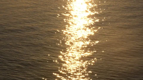 Sunset reflection sparkles on tiny ripples of sea water wave. Slow motion 스톡 동영상 97659479
