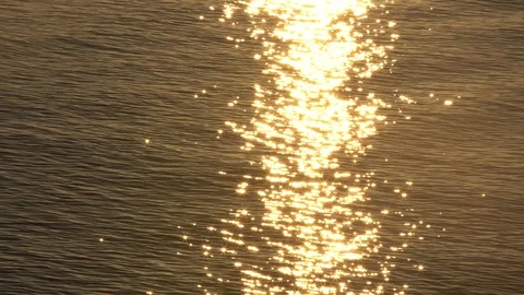 Sunset reflection sparkles on tiny ripples of sea water wave Stock Footage 100007929