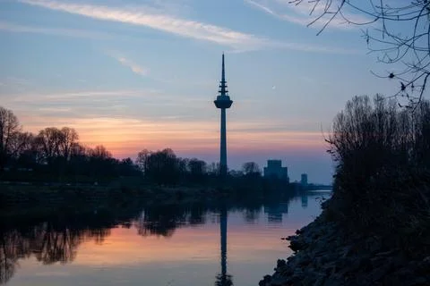 Sunset reflection with tower silhouette Stock Photos