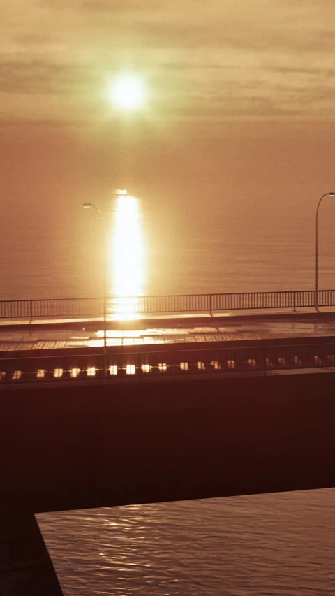 Sunset reflection on water near bridge with light and calm setting Stock Footage 340647200