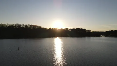 Sunset reflection on water surface, countryside lake view in sunset, peaceful Stock-Footage 302016325