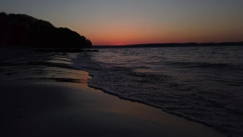 Sunset reflection on the waves and sand Stock Footage 112921295