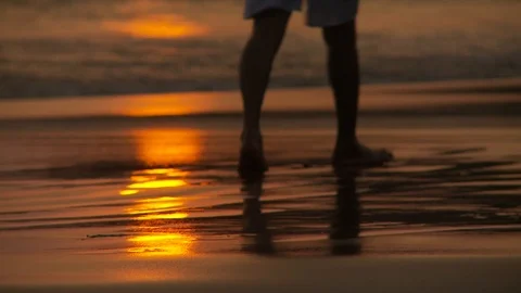Sunset reflection on wet sand beach, close up Stock Footage 125747209