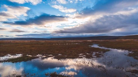 Sunset reflection in wetland landscape in time lapse Stock Footage 100496616