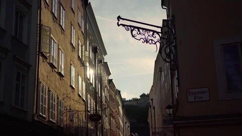 Sunset reflection on windows of historic houses in old town Salzburg Austria Stock Footage 281653434