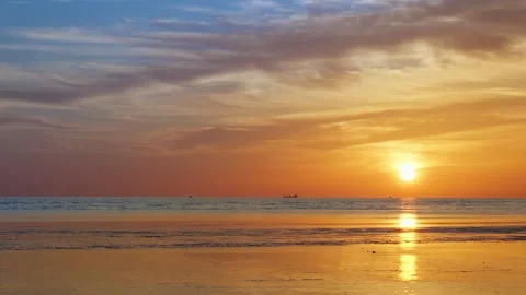 Sunset Reflections and Gentle Ripples Coastal Horizon with Distant Boats Stock Footage 312920097