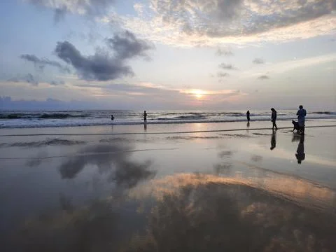Sunset reflections on the beach. sky reflections on the water. Stock Photos