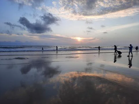 Sunset reflections on the beach. sky reflections on the water. Stock Photos