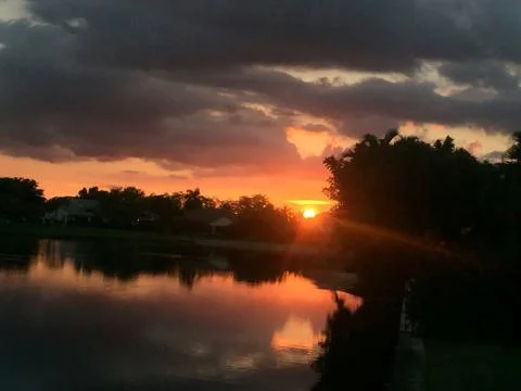 Sunset reflections in the golf course Stock Photos