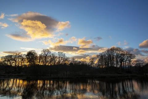 Sunset reflections in the River Brathay, Ambleside, Lake District, UK. Stock Photos