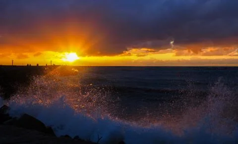 Sunset reflections in the waves Stock Photos