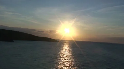 Sunset reflects on sea - HD Stock Footage 8628462