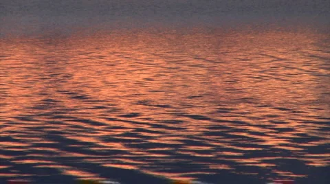 Sunset reflex on lake mid1 Stock Footage 1052607