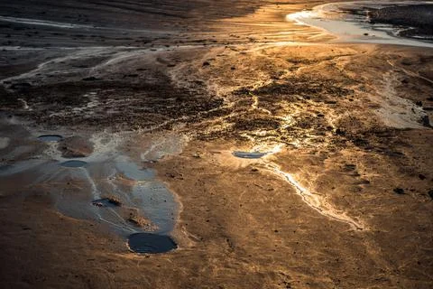 Sunset Reflexions on Mud Lava Stock Photos