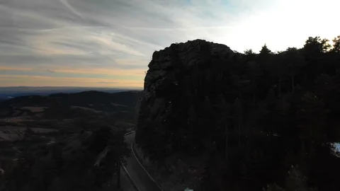 Sunset Reveal on Quiet Mountain Road Stock Footage 123420002