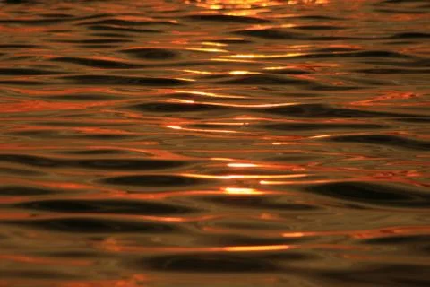 Sunset ripple reflection Stock Photos