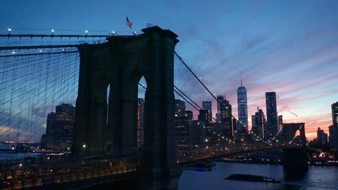 Sunset rising and tilting down over Brooklyn Bridge Stock Footage