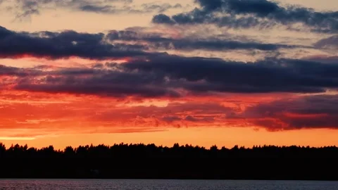 Sunset on the river above the forest on a summer evening. Paints. Color Stock Footage 158382481