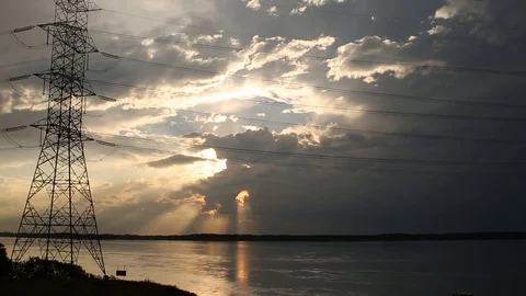 Sunset on the river and electric power Stockbeeldmateriaal 87968210