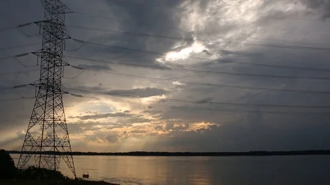 Sunset on the river and electric power Stockbeeldmateriaal 87968232