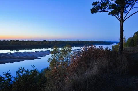 Sunset on the river bank Stock Photos