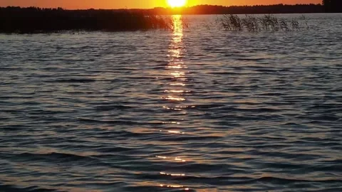 Sunset on the river. A beautiful time. Video stock 233578197