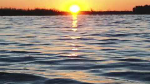 Sunset on the river. A beautiful time. Video stock 233578219