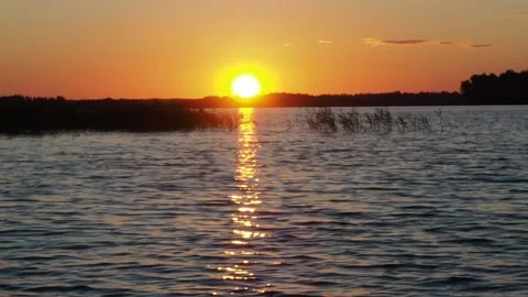 Sunset on the river. A beautiful time. Video stock 233578233