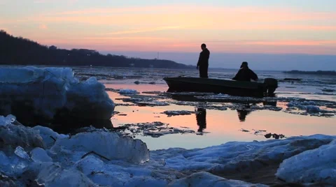 Sunset on The River with Boat and Two Men passing by on Stock Footage 41766368