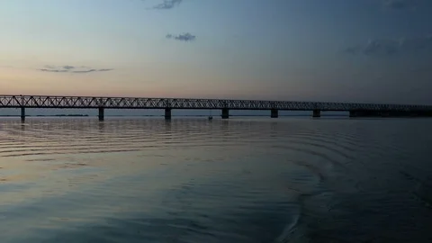 Sunset on the river with bridge. Video shooting from the boat Stock Footage 114759824