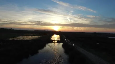 Sunset on River &amp; Evening Sun Reflection in Water Stock Footage 67715760
