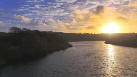 Sunset river focus on the colour and water movement Video stock 264508575