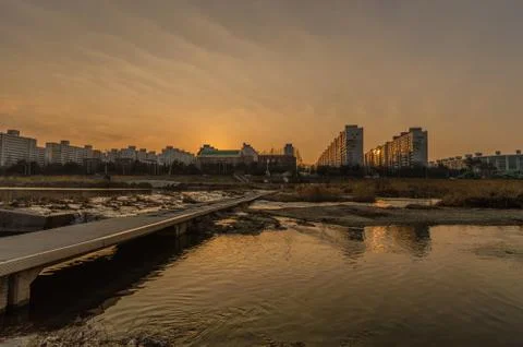 Sunset at a river i Stock Photos