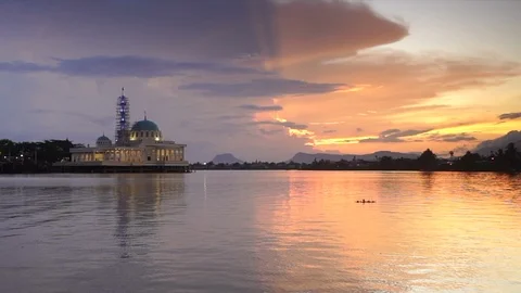 Sunset at river with mosque Stock Footage 104940099