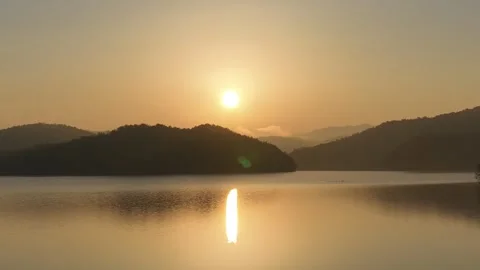A sunset river with the mountain and trees Video stock 303550931