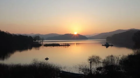 A sunset river with the mountain and trees Video stock 303550944