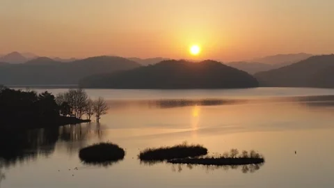 A sunset river with the mountain and trees Video stock 303550952