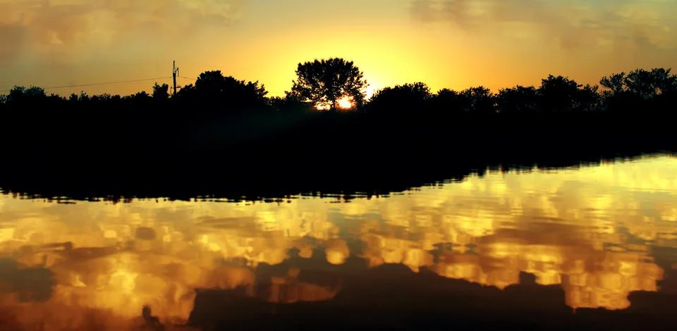 Sunset on the river. Stock Photos