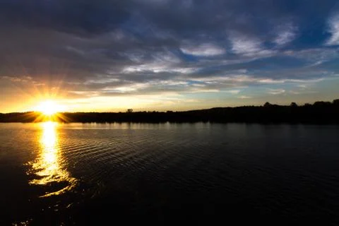 Sunset on river Stock Photos