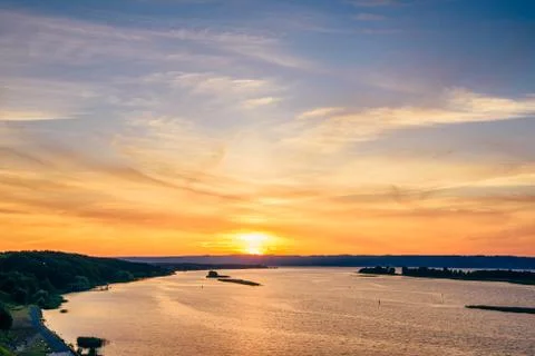 Sunset on river shore. Stock Photos