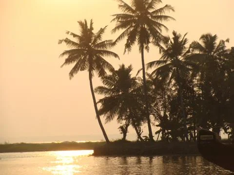 Sunset in River side with Reflection on water Coconut tree area Stock-Fotos