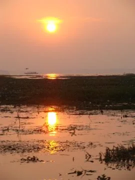Sunset in River side with Reflection on water beautiful natural beauty Stock Photos