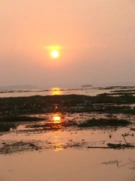 Sunset in River side with Reflection on water beautiful natural beauty Stock Photos